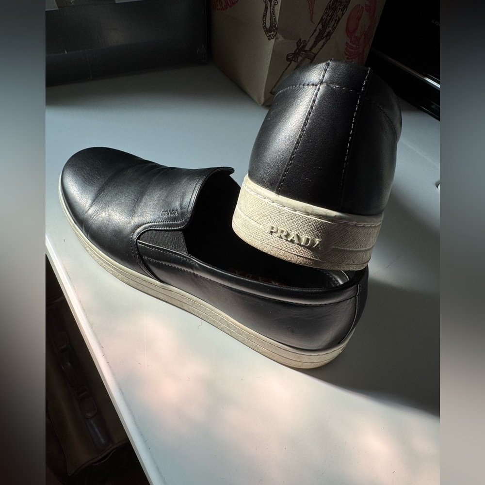 Prada Men's Black Slip-On Loafers..
Fit large I’m 10.5 - 11 and fit perfectly. - Picture 3 of 8